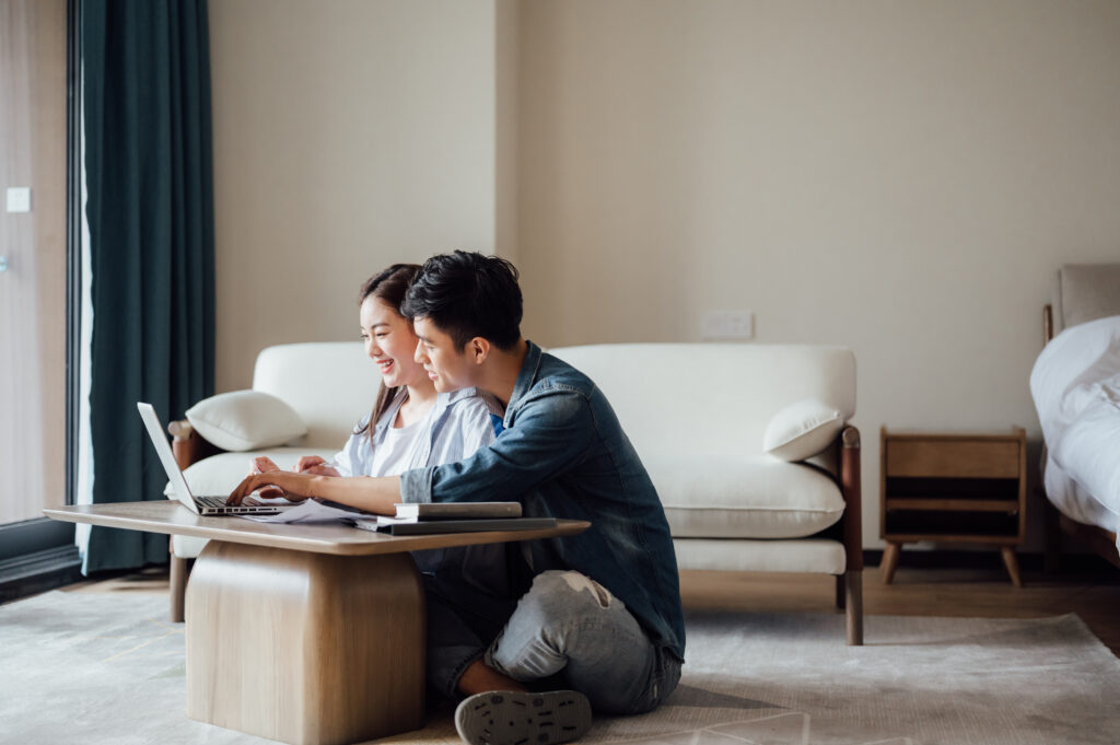 "An image of a married couple working together on a laptop, encapsulating the essence of 'companionship in marriage'. Their shared task and collaborative effort reflect a partnership rooted not only in love but also mutual support and understanding.